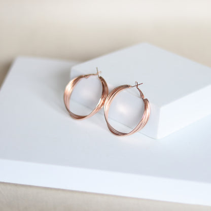intertwine hoops   rose gold