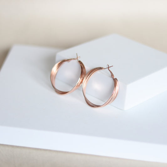 intertwine hoops   rose gold